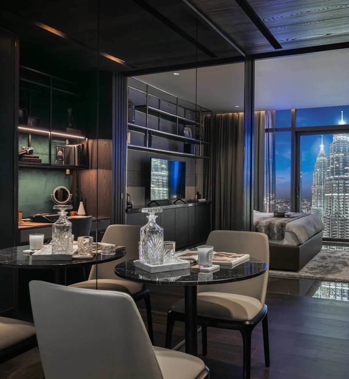 Living and dining suite with Twin Towers view at CloutHaus Residences