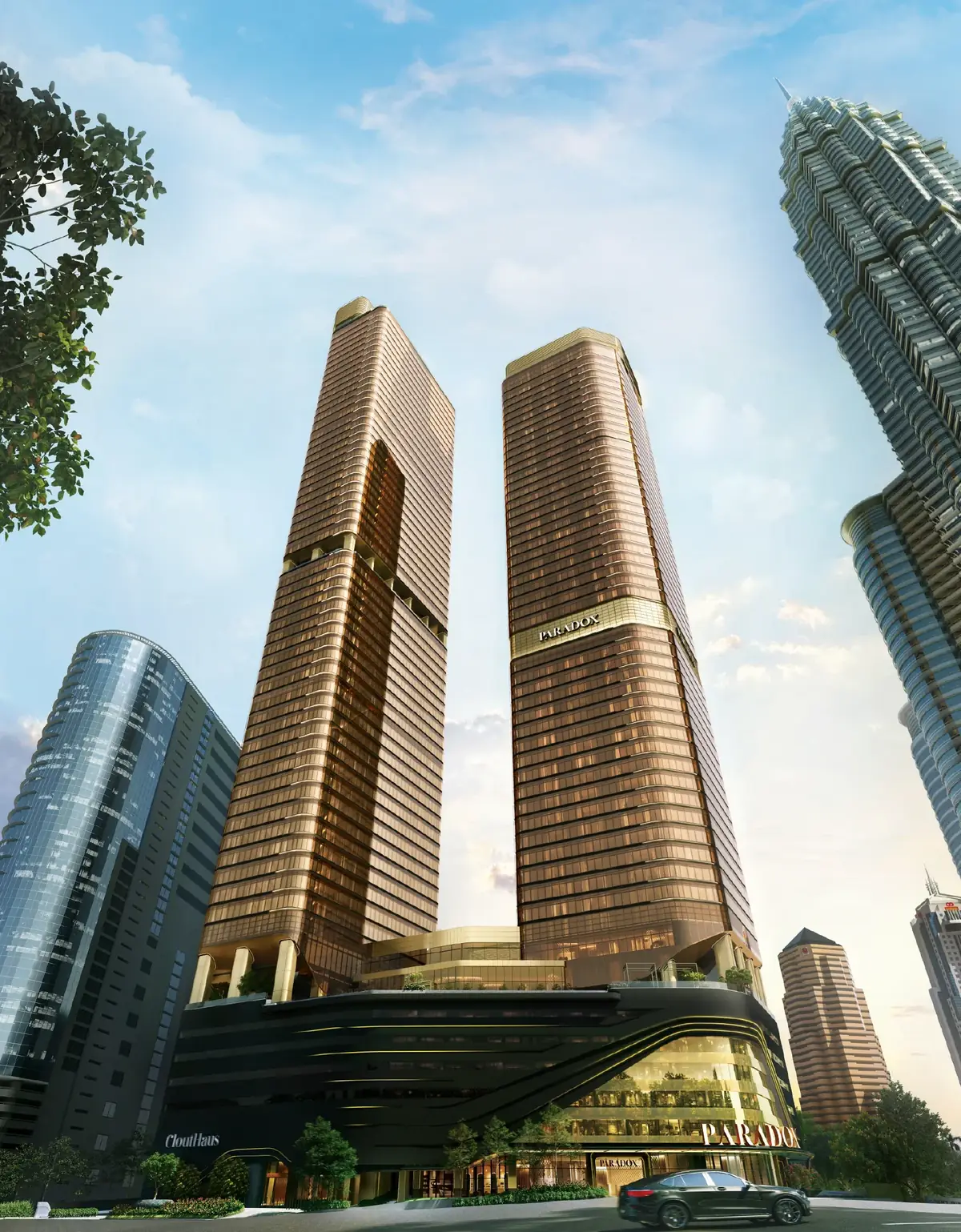 CloutHaus Residences twin towers above the Paradox hotel podium, beside the Petronas Twin Towers